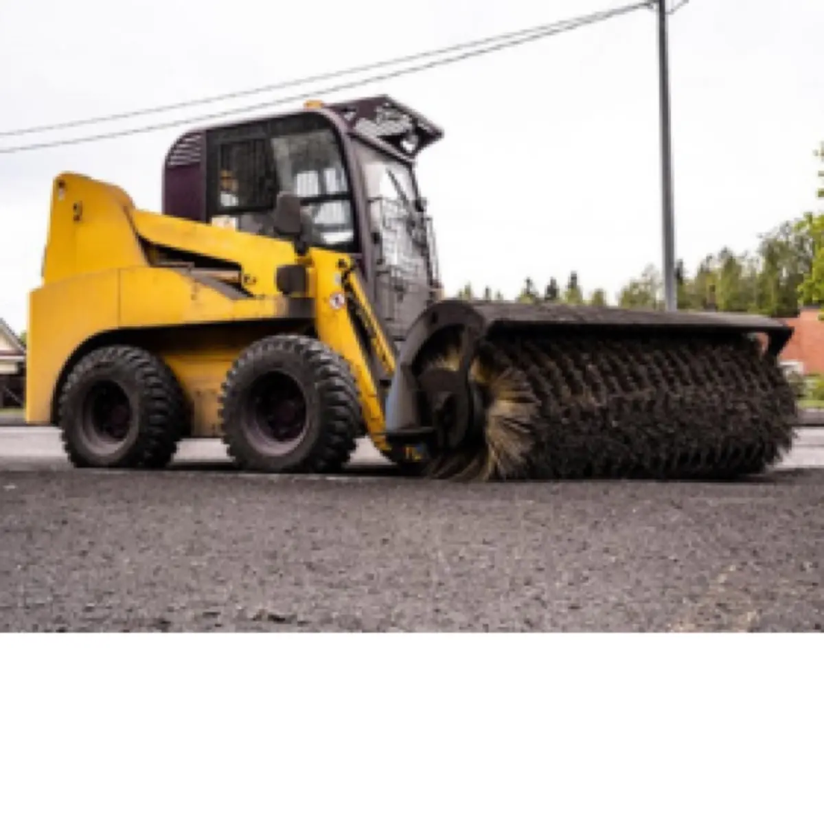 Skid Loader with Cleaning Brush